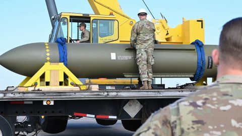  In this photo released by the US Air Force on May 2, 2023, airmen look at a GBU-57, known as the Massive Ordnance Penetrator, at Whiteman Air Base in Missouri.