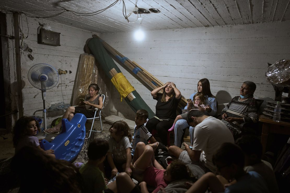 Israelis take shelter during air raid sirens warning of incoming strikes by Iran, in Bnei Brak, near Tel Aviv, Israel, on June 17.