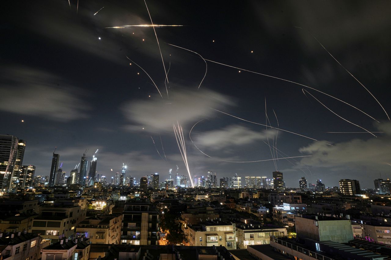 The Israeli Iron Dome air defense system fires to intercept missiles during an Iranian attack over Tel Aviv, Israel, early Wednesday.