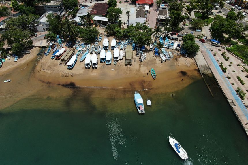 Boats fill Manzanillo beach as others are removed from the water in Acapulco, Mexico, on Wednesday, ahead of the arrival of Hurricane Erick.