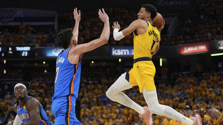 Indiana Pacers guard Tyrese Haliburton, right, passes over Oklahoma City Thunder forward Chet Holmgren (7) during the first half of Game 6 of the NBA Finals basketball series, Thursday, June 19, 2025, in Indianapolis. (AP Photo/Abbie Parr)