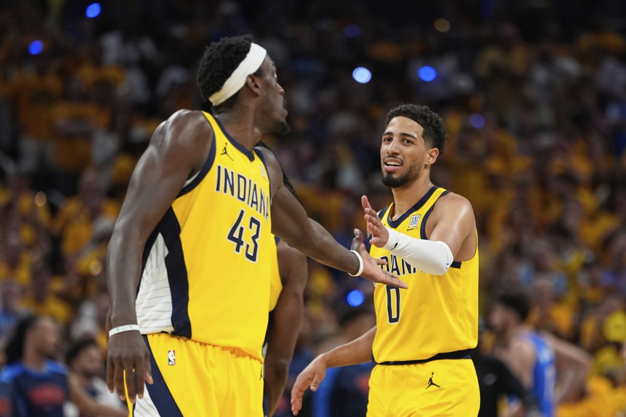 Pascal Siakam, left, and Tyrese Haliburton helped the Pacers win their last home game of the season.