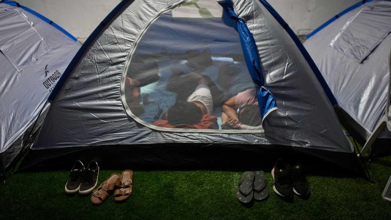 People spend the night in a public shelter as a precaution against possible Iranian missile attacks, in Tel Aviv, Israel, Saturday, June 21, 2025. (AP Photo/Ohad Zwigenberg)