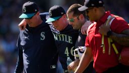 Seattle Mariners pitcher Trent Thornton had to be helped off the field during the eighth inning at Wrigley Field.