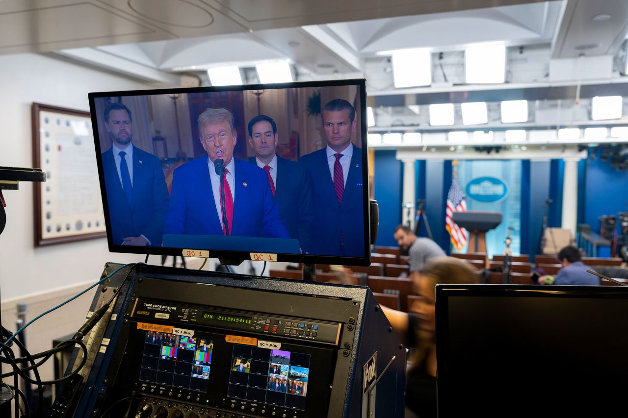 President Donald Trump speaks from the East Room of the White House, as seen on a television monitor in the James Brady Press Briefing Room, on Saturday.
