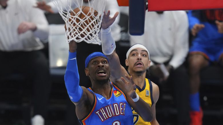 Oklahoma City Thunder guard Shai Gilgeous-Alexander, left, shoots against Indiana Pacers guard Andrew Nembhard during the second half of Game 7 of the NBA Finals basketball series Sunday, June 22, 2025, in Oklahoma City. (AP Photo/Nate Billings)