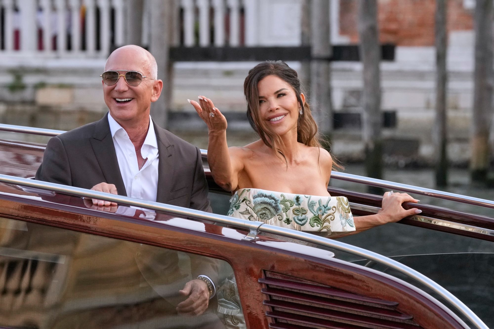 Jeff Bezos and Lauren Sanchez leave a hotel for their pre-wedding reception in Venice, Italy on Thursday.