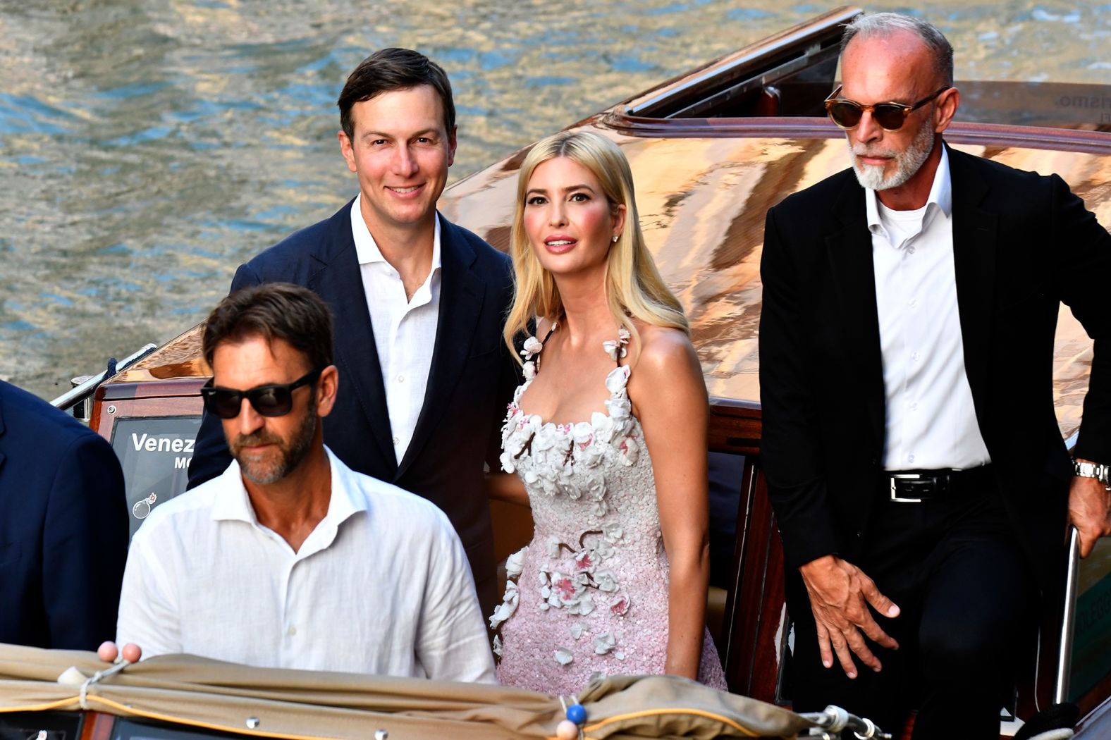 Ivanka Trump wore a sequined cherry blossom cocktail dress by Oscar de la Renta as she and husband, Jared Kushner, ferried to the week's first events on Thursday.