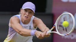 Poland's Iga Swiatek hits a backhand against Italy's Jasmine Paolini in their semifinal match at the WTA tennis tournament in Bad Homburg, Germany, Friday, June 27, 2025. (AP Photo/Michael Probst)