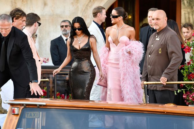 Kim and Khloe Kardashian leave their hotel for the wedding on Friday.