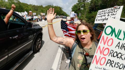 Environmental advocates and protesters at the Dade-Collier Training and Transition Airport on Tamiami Trail E, Ochopee, Fla., on Saturday, June 28, 2025, object to the "Alligator Alcatraz" being built at the facility.
