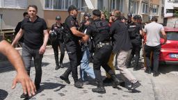 A person is detained by Turkish police officers as he tries to gather with others to celebrate the annual LGBTQ+ Pride March, in Istanbul, Turkey, Sunday, June 29, 2025. (AP Photo/Dilara Acikgoz)