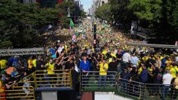 Former Brazilian President Jair Bolsonaro, in blue, takes part in a protest against his Supreme Court trial in Sao Paulo on Sunday.