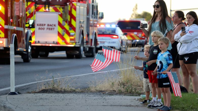 A procession from Kootenai Health headed to Spokane after two firefighters were killed on Sunday.