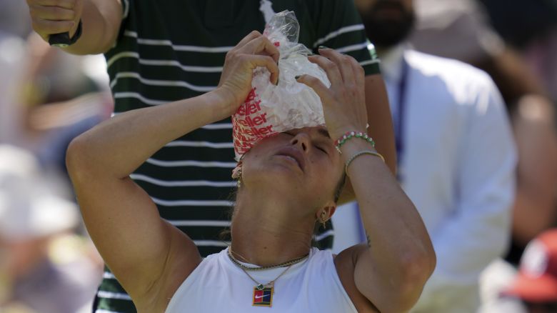 Aryna Sabalenka cools down during her first-round match against Carson Branstine.