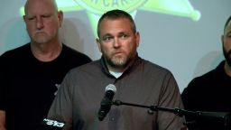 In this screenshot from a video provided by WLOS, Cherokee County Sheriff Dustin Smith speaks at a press conference in Murphy, North Carolina, about an escaped inmate that shot and killed a detention officer on Monday, June 30, 2025.