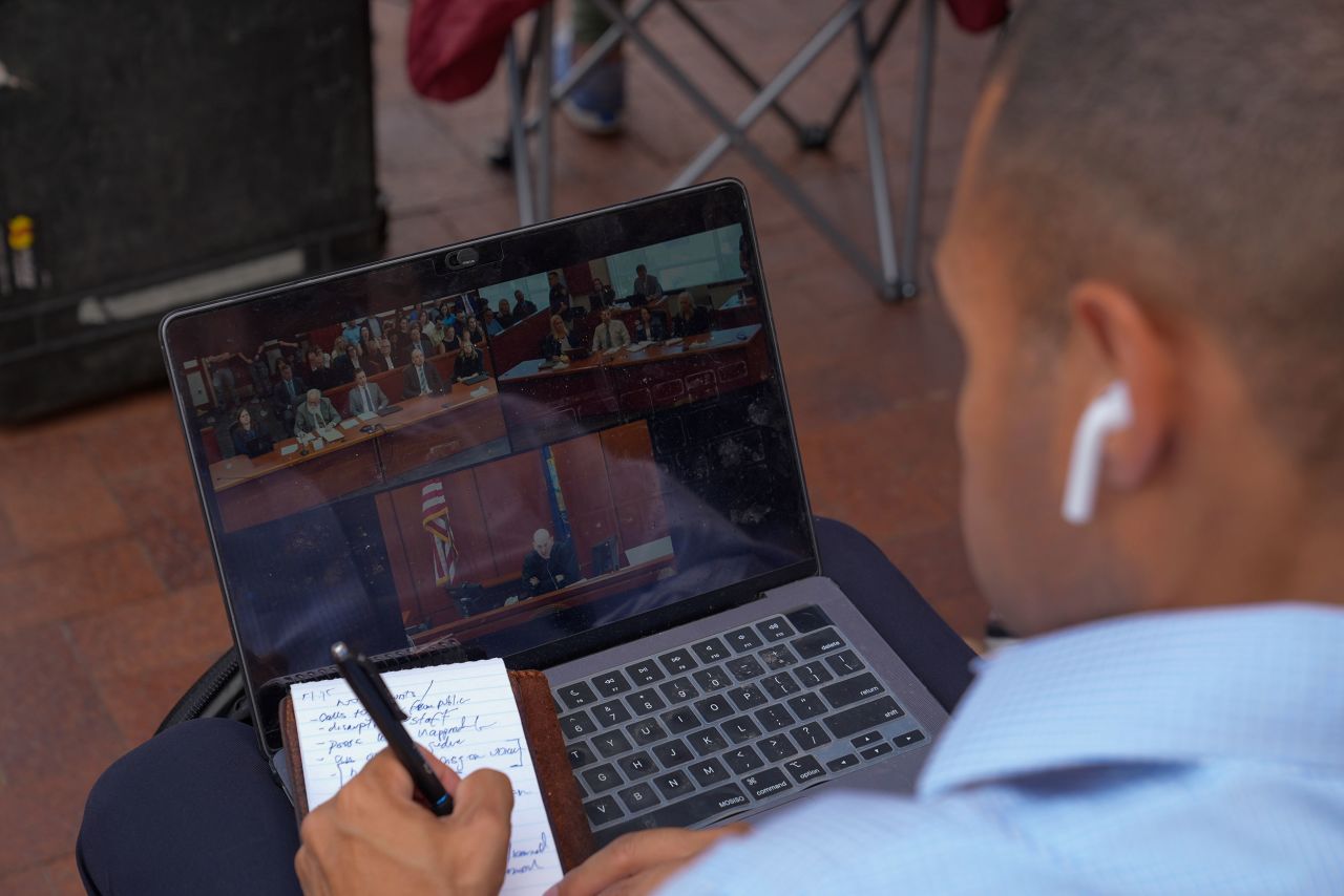 A member of the media watches the livestream from outside the Ada County Courthouse as Bryan Kohberger pleaded guilty to murder in the fatal stabbing of four University of Idaho students in 2022 on July 2 in Boise.