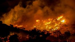 Fire burns in the Ahlia area near the port town of Ierapetra on the south coast of Crete island, Greece, late Wednesday, July 2, 2025, prompting the evacuation of villages and hotels in the region, authorities said.