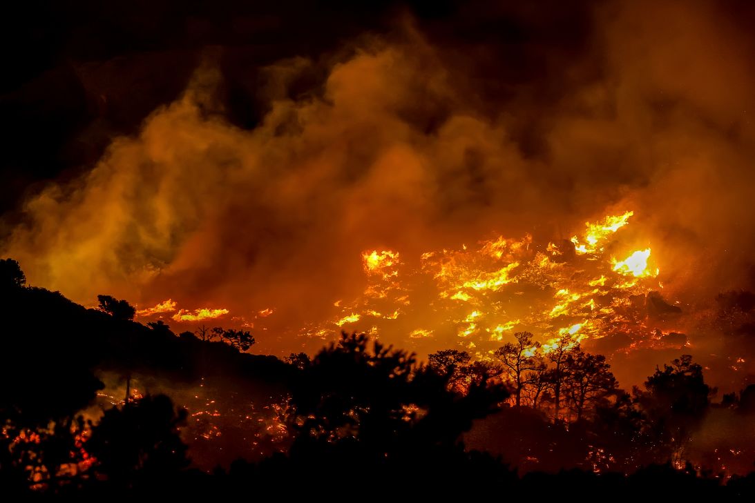 Fire burns near the port town of Ierapetra on Crete late Wednesday.