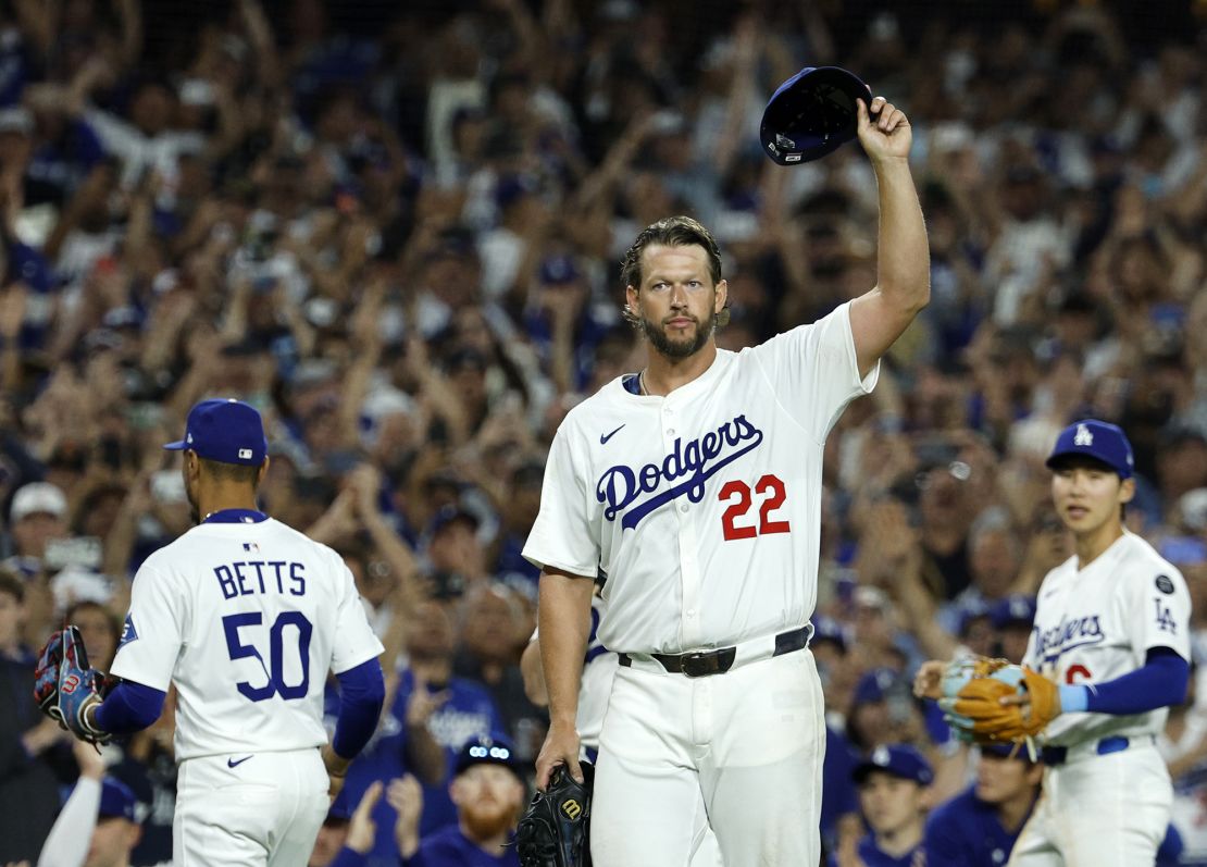 Los Angeles Dodgers pitcher Clayton Kershaw tips his cap after recording his 3,000th career strikeout.