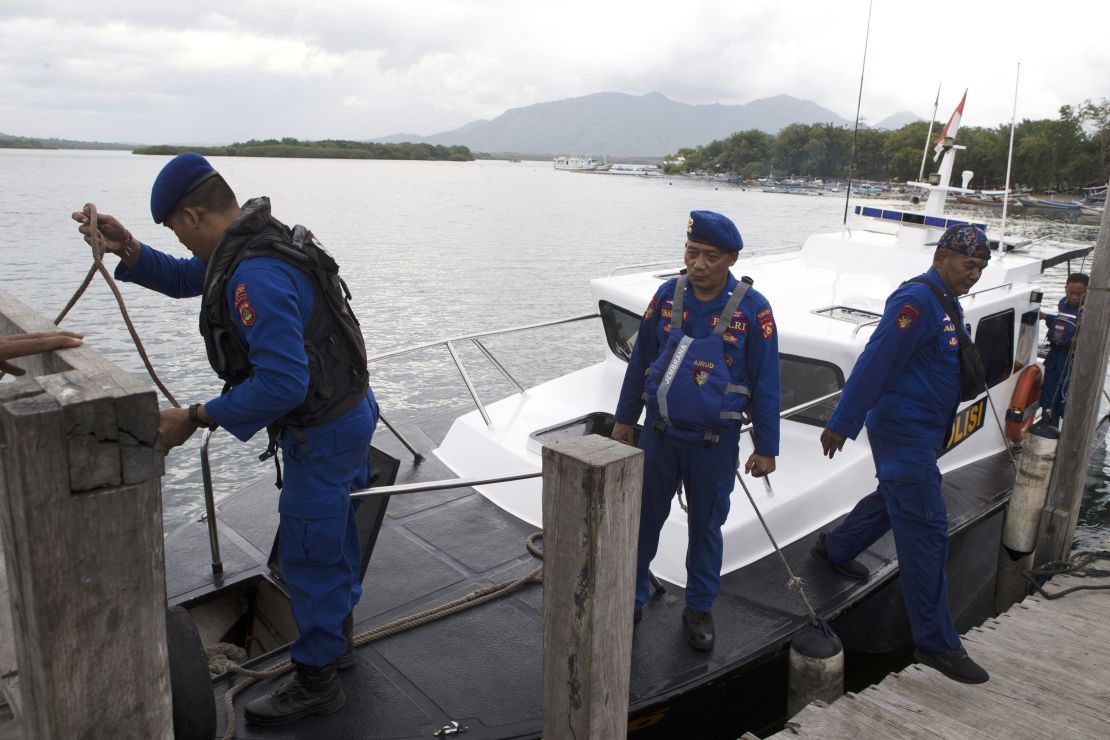 Indonesian Marine Police officers dock their boat after a search operation for victims in Jembrana on Bali island, Indonesia, Thursday, July 3, 2025.