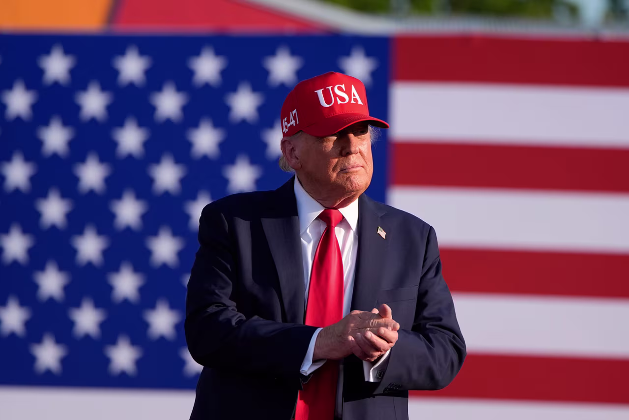 President Donald Trump arrives to speak at a rally at the Iowa State Fairgrounds on Thursday, in Des Moines, Iowa.