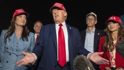 President Donald Trump, center, speaks with reporters as, from left, Agriculture Secretary Brooke Rollins, Rep. Zachary Nunn, R-Iowa, Rep. Randy Feenstra, R-Iowa, and Homeland Security Secretary Kristi Noem listen as they arrive on Friday, July 4, 2025, at Joint Base Andrews, Md. (AP Photo/Alex Brandon)