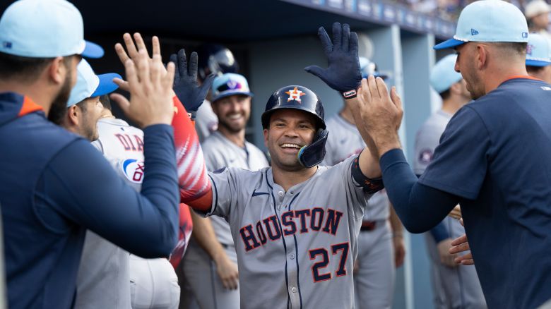 Jose Altuve celebrates in the dugout after his two-run home run during the third inning.