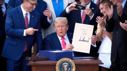 President Donald Trump signs "Big Beautiful Bill" during a Fourth of July celebration event on the South Lawn at the White House in Washington on July 4.