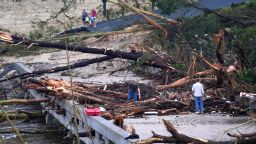 Debris covers a bridge over the Guadalupe River after a flash flood swept through the area in Ingram, Texas.