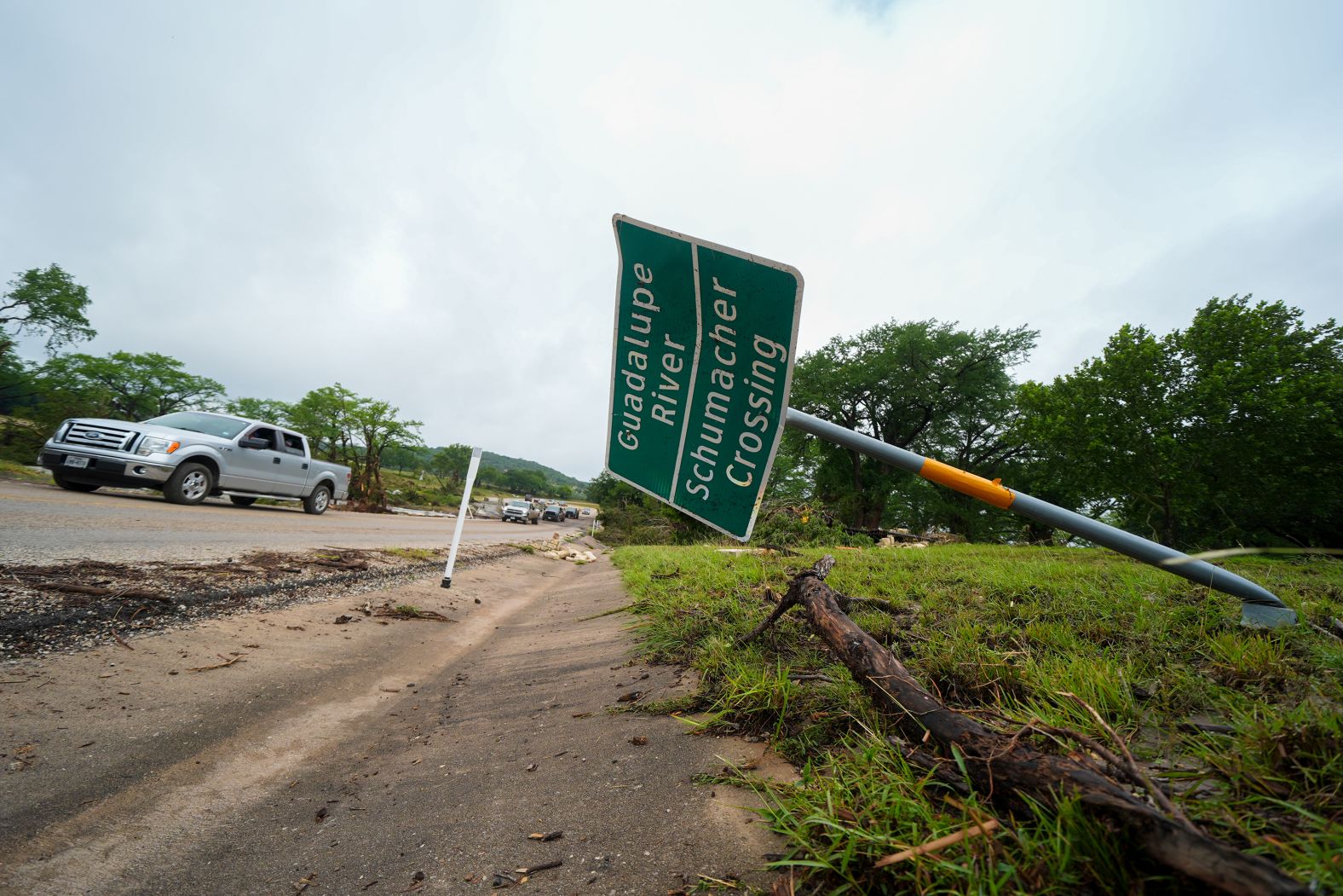 A downed sign is seen after a flash flood swept through the area in Ingram.