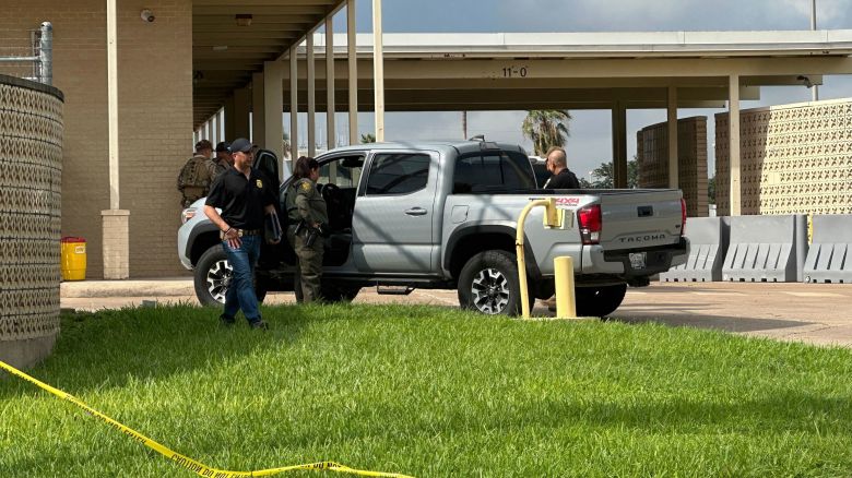 Officials work the scene of a shooting at a Border Patrol facility in McAllen, Texas, Monday, July 7, 2025. (AP Photo/Valerie Gonzalez)
