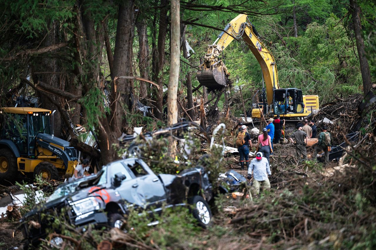 First responders carry out search and rescue operations near the Guadalupe River after a flash flood swept through the area, in Ingram, Texas on Monday.