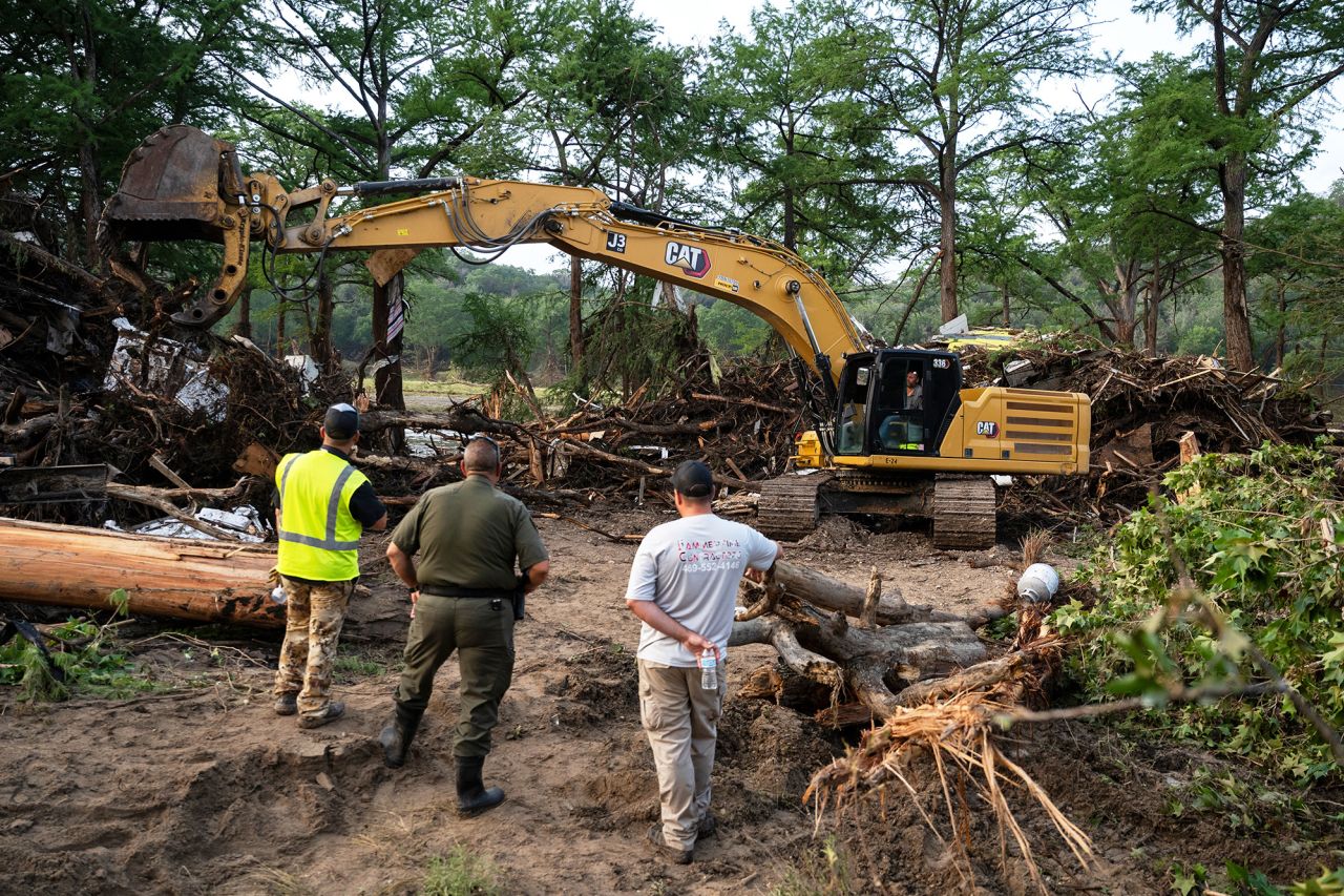 First responders carry out search and rescue operations near the Guadalupe River on Monday.