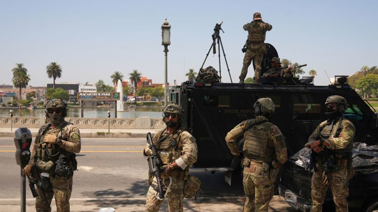 Federal agents stage at MacArthur Park in Los Angeles on July 7, 2025.