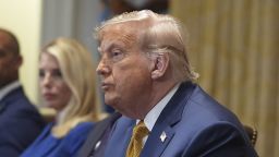 President Donald Trump, center, speaks during a cabinet meeting at the White House, Tuesday, July 8, 2025, in Washington.