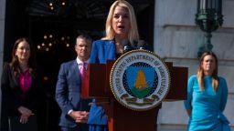Attorney General Pam Bondi, front, with Agriculture Secretary Brooke Rollins, back left to right, Secretary of Defense Pete Hegseth and Arkansas Gov. Sarah Huckabee Sanders, speaks during a news conference at the Department of Agriculture to rollout the USDA'S National Farm Security Action Plan and discuss actions being taken to protect American agriculture from foreign threats in Washington, Tuesday, July 8, 2025. (AP Photo/Manuel Balce Ceneta)
