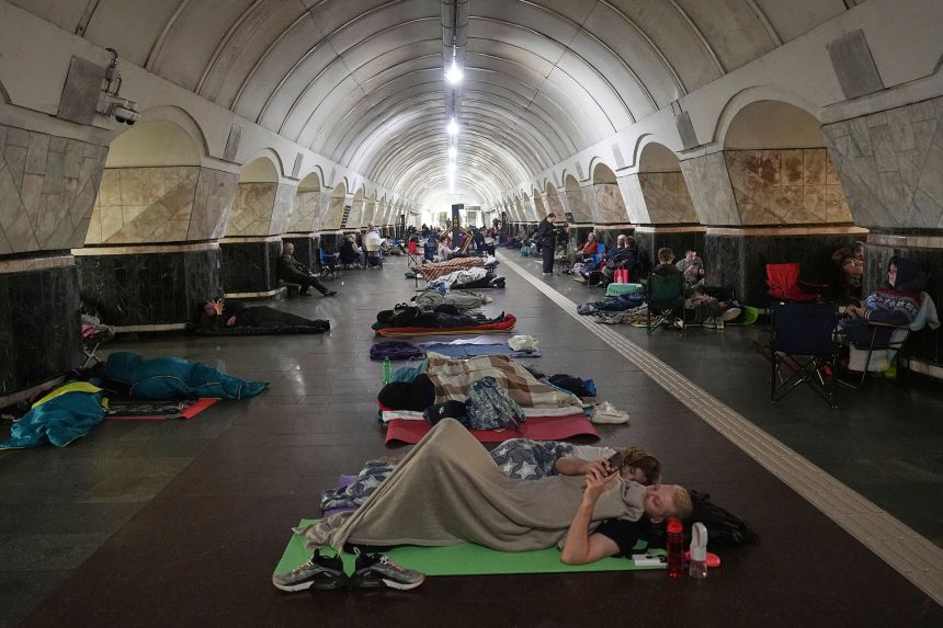 People rest in a metro station, being used as a bomb shelter, during a Russian attack in Kyiv, Ukraine, early on  July 10.