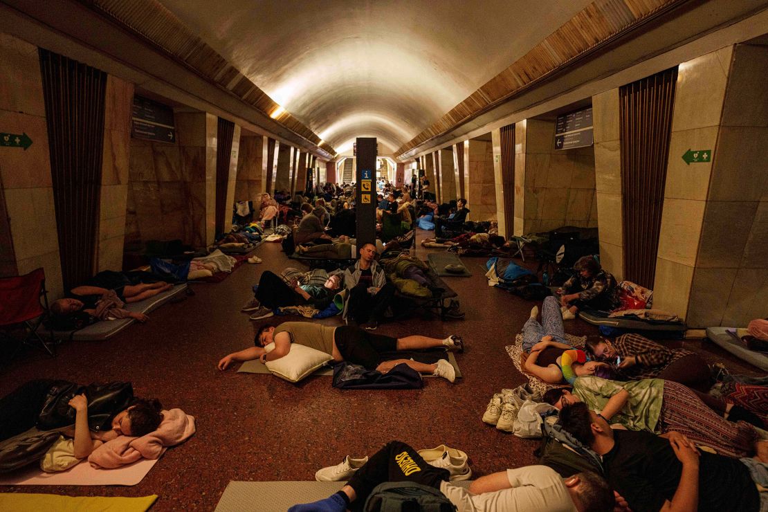 People sleep on the platform of a metro station in Kyiv, as they take cover during a Russian attack on Thursday.