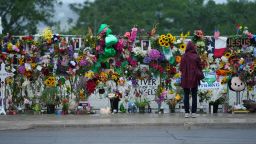 A visitor views a memorial wall for flood victims, Sunday, July 13, 2025, in Kerrville, Texas.