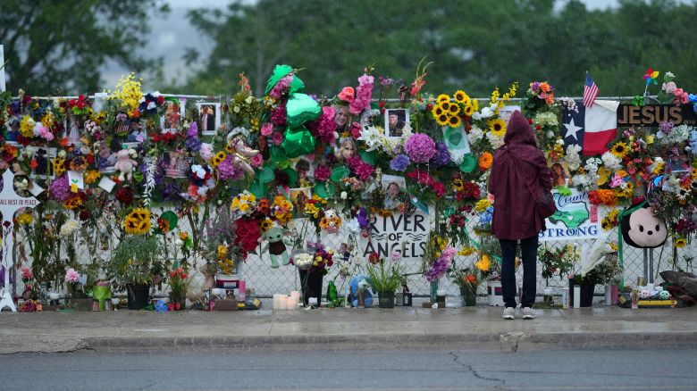A visitor views a memorial wall for flood victims, Sunday, July 13, 2025, in Kerrville, Texas.