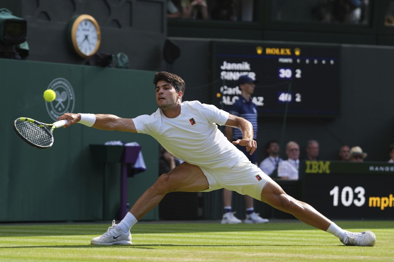Alcaraz stretches for a forehand shot in the first set, which he won.