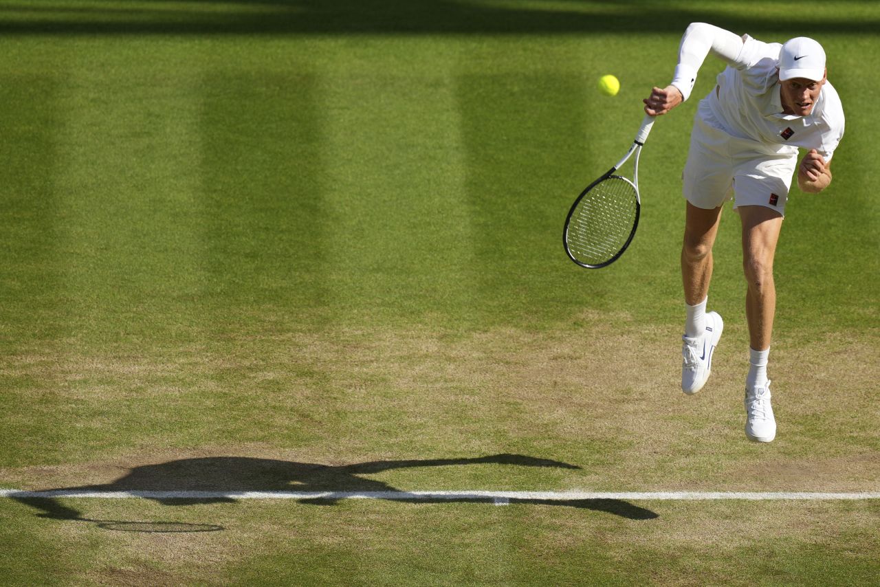 Jannik Sinner serves to Carlos Alcaraz in the fourth set.
