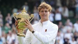 Jannik Sinner of Italy holds the trophy after winning the men's singles final match against Carlos Alcaraz of Spain at the Wimbledon Tennis Championships in London, Sunday, July 13, 2025.(AP Photo/Kirsty Wigglesworth)