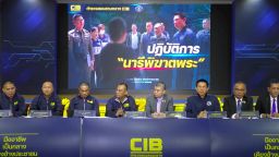 A screengrab made from the livestream of Thailand's Central Investigation Bureau holding a press conference in Bangkok, on Tuesday, July 15, 2025, about the arrest of a woman involved in a sex scandal that caused several senior monks to leave monkhood.