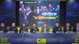 A screengrab made from the livestream of Thailand's Central Investigation Bureau holding a press conference in Bangkok, on Tuesday, July 15, 2025, about the arrest of a woman involved in a sex scandal that caused several senior monks to leave monkhood.