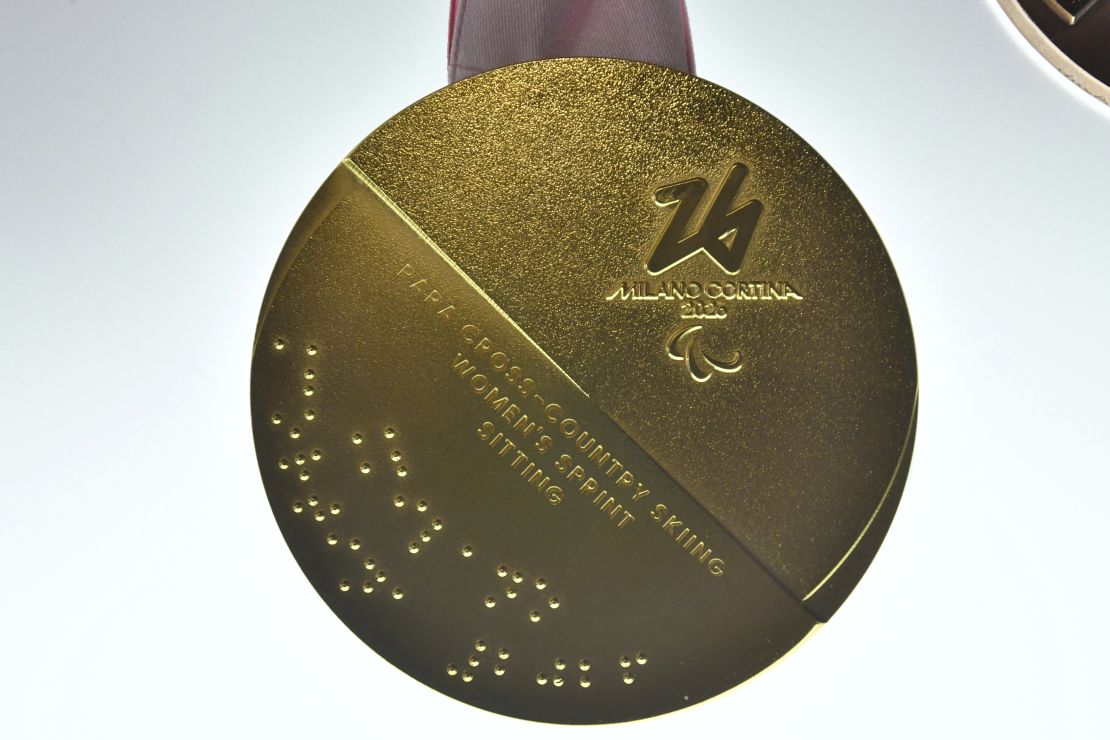 The unveiling included a glimpse at a Winter Paralympics Gold, which has text in Braille.