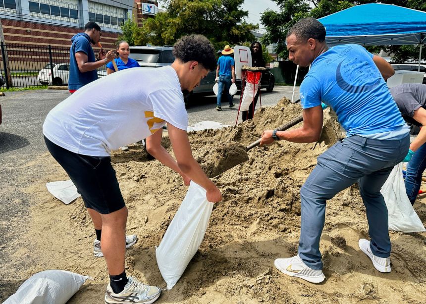 Volunteers fill sandbags for New Orleans residents Wednesday anticipating heavy rain from a tropical weather system moving toward the Gulf Coast.