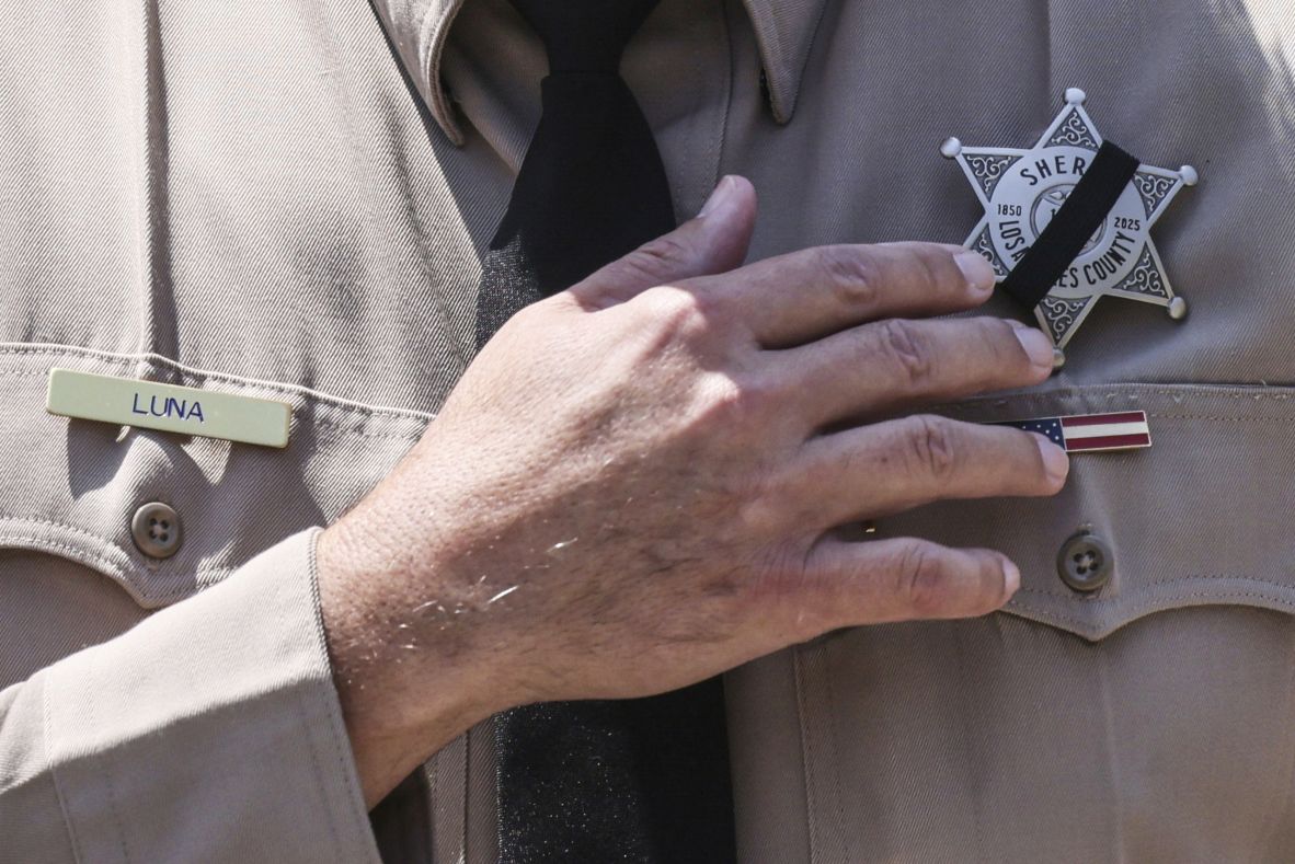 Los Angeles County Sheriff Robert Luna wears a band over his badge after three members of the department <a  target="_top" href="/newspapers?url=https://www.cnn.com/2025/07/18/us/lasd-facility-explosion-east-los-angeles">were killed in an explosion at a training facility</a> on Friday, July 18. The explosion is believed to have been an accident.