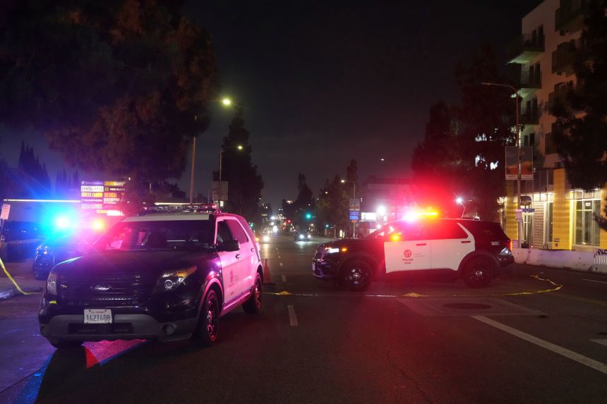 Police patrol vehicles close Vermont Ave. after a vehicle rammed into a crowd gathered outside